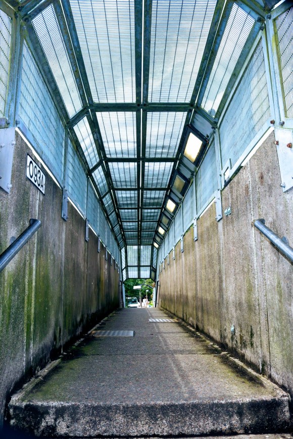 'Bridge O93A' - a view inside the canopied footbrige just outside Epping station