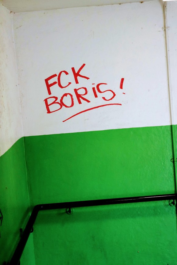 'FCK Boris' daubed in red paint on a white wall