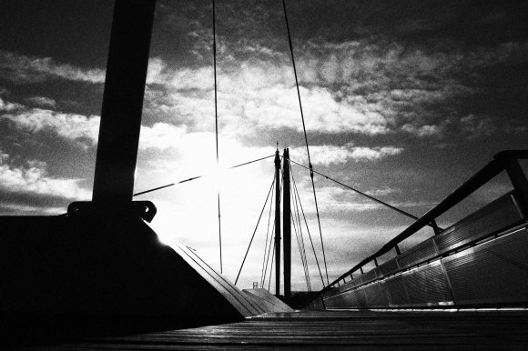 A view of the bridge struts looking directly inot the sun, which casts deep shadows