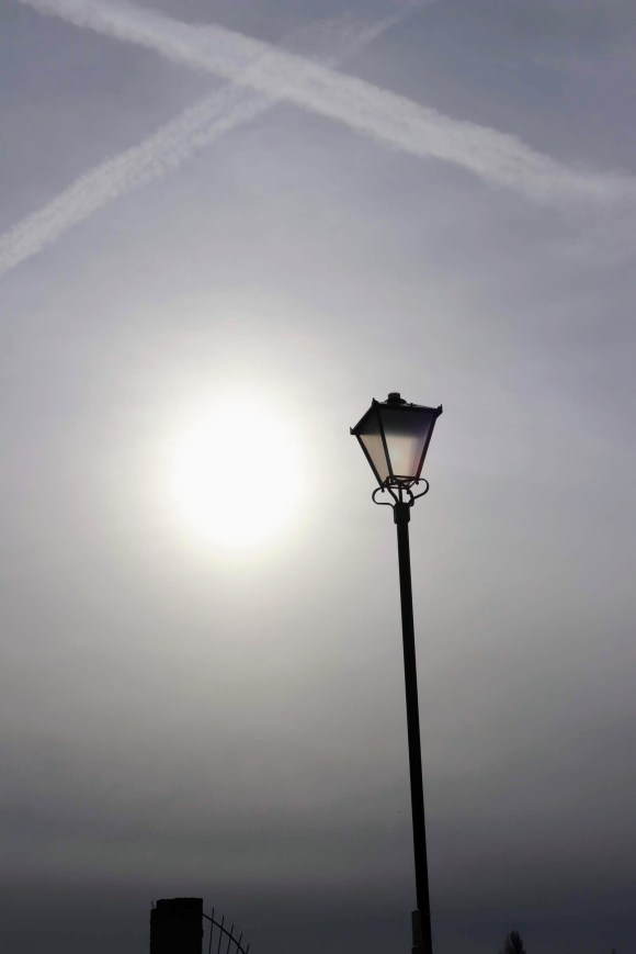 a shot gazing into a wintry sun with a victorian lamp providing the only point of reference