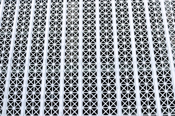 an array of square blocks each with a cross pattern creating a visual pattern