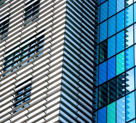 this is a section of the east facade of the Royal London Hospital covered in an array of aerofiols which creates a striking striped black and white covering