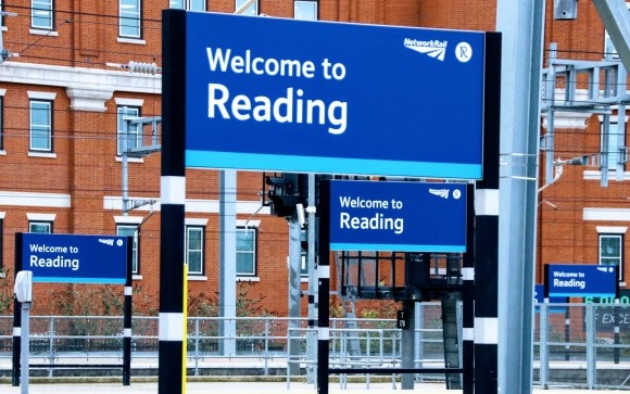 this is a view across Reading station where there are five 'Welcome to Reading' signs