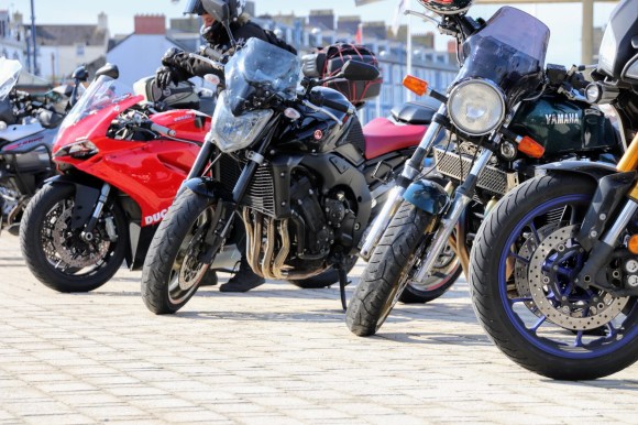 a variety of motorbikes parked up on the promenade at Aberystwyth