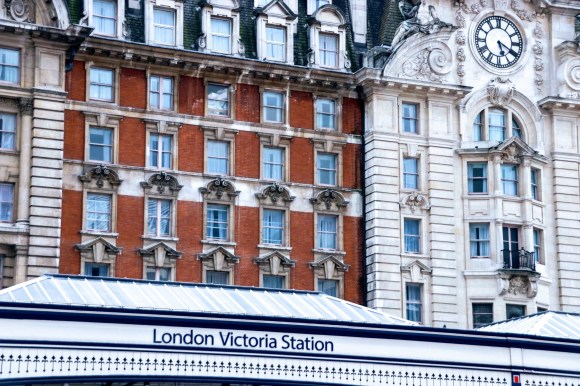 an external view of the station displaying the hotel frontage with the 'London Victoria Station' sign