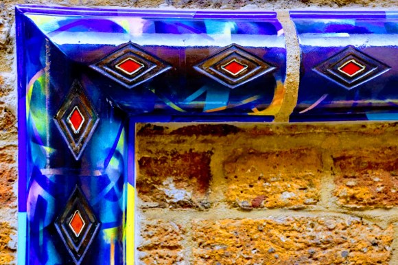 bright blue ceramic frame with red diamand inserts