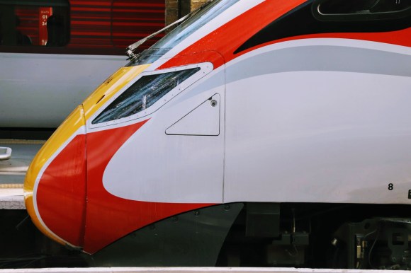 the front of an Azuma train showing off its red and white livery
