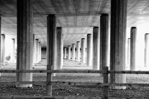 pillar supports holding up the A13 flyover. The shot captures the pillars in formation looking along the length of the flyover