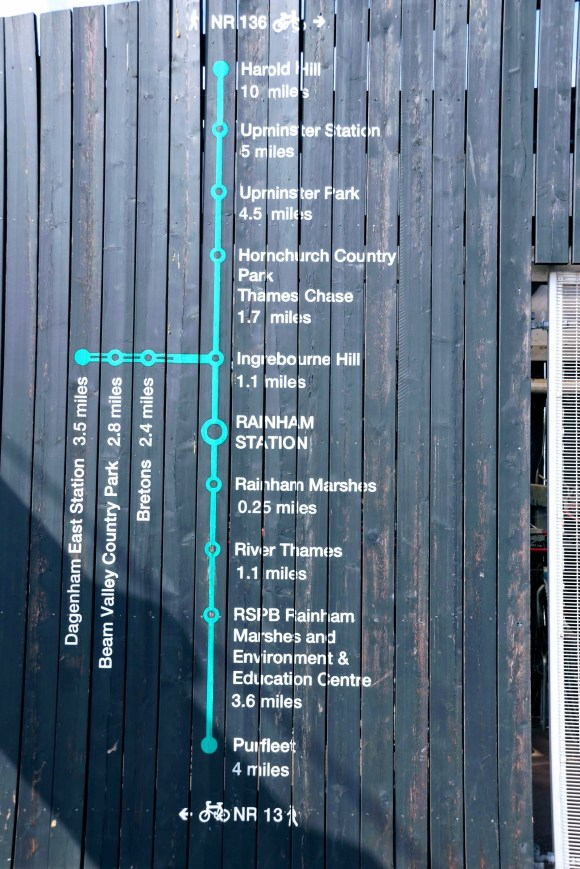 a simple directional map on the side of the station showing Rainham as the centrepiece and distance markers to Dagenham East Station 3.5 miles; Purfleet 4 miles; and Harold Hill 10 miles