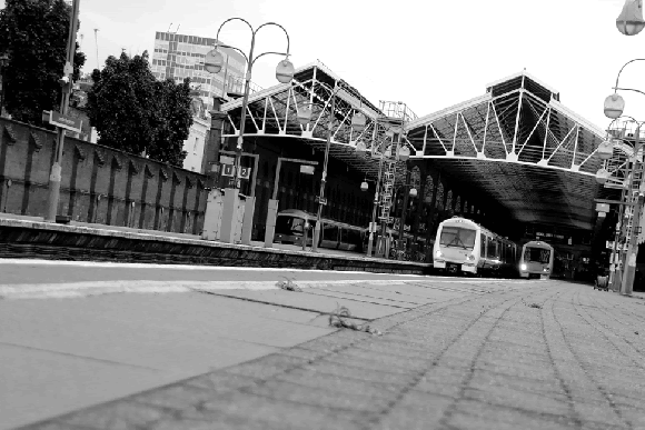 an animation of a diesel unit of two carriages departing the station from platform 3