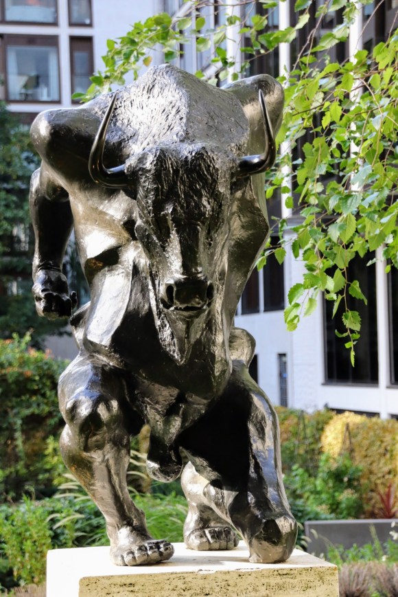 Colour: a full frontal view of the Minatour which is kneeling on its left leg as if poised to charge