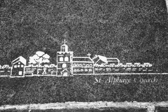 Black & White: a white floor etching of a portrayal of 'St Alphage Church' on a slate grey slab
